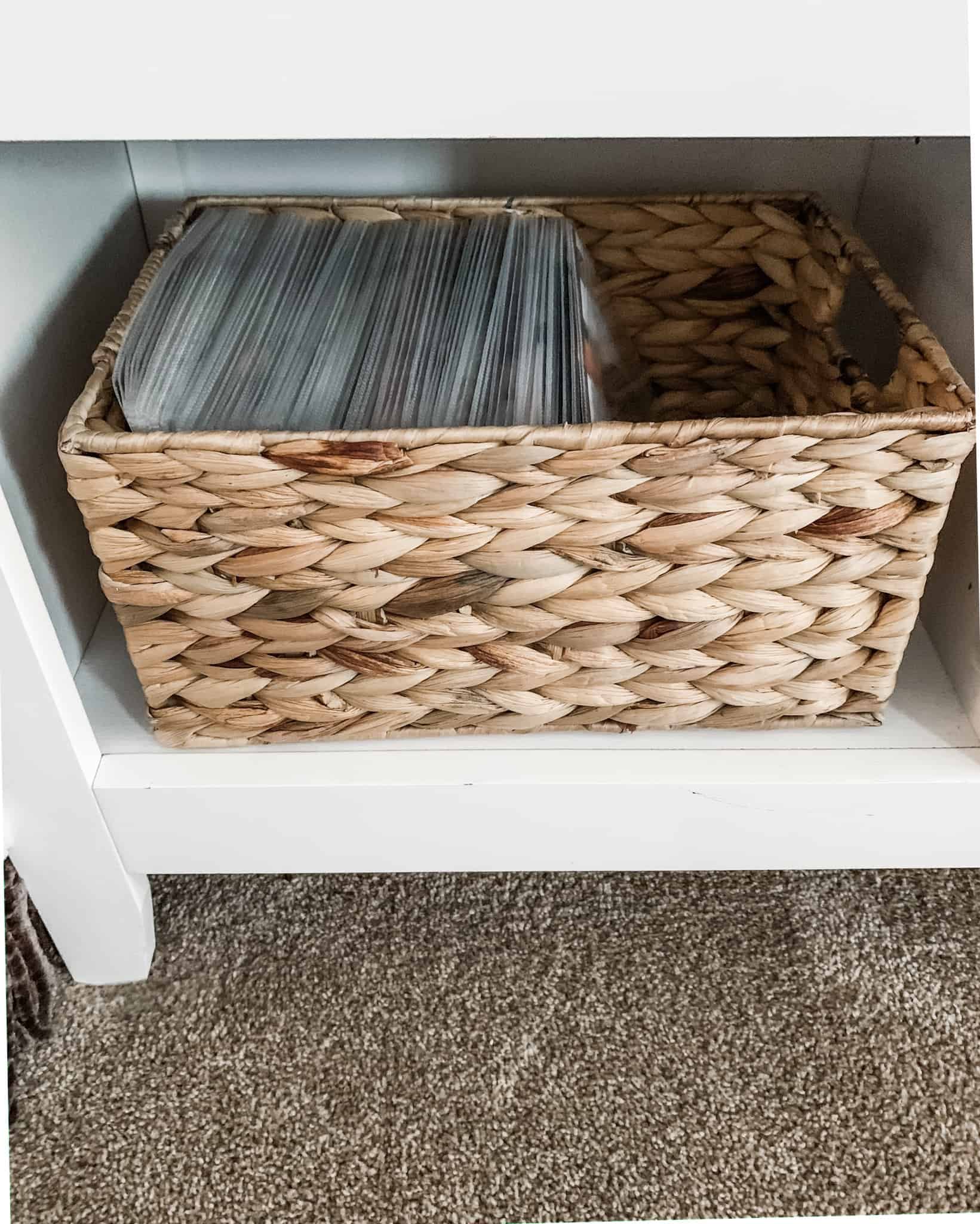 DVDs stored in a basket in sleeves for a DVD storage idea