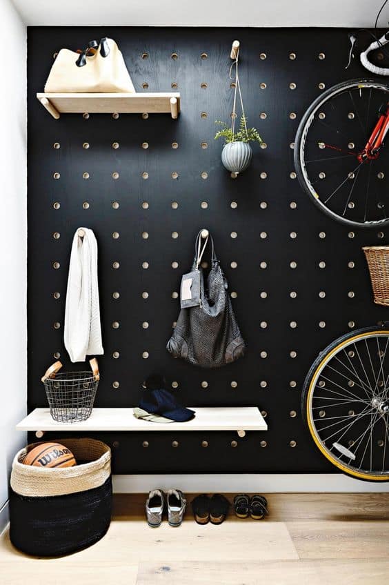 black wall pegboard organization