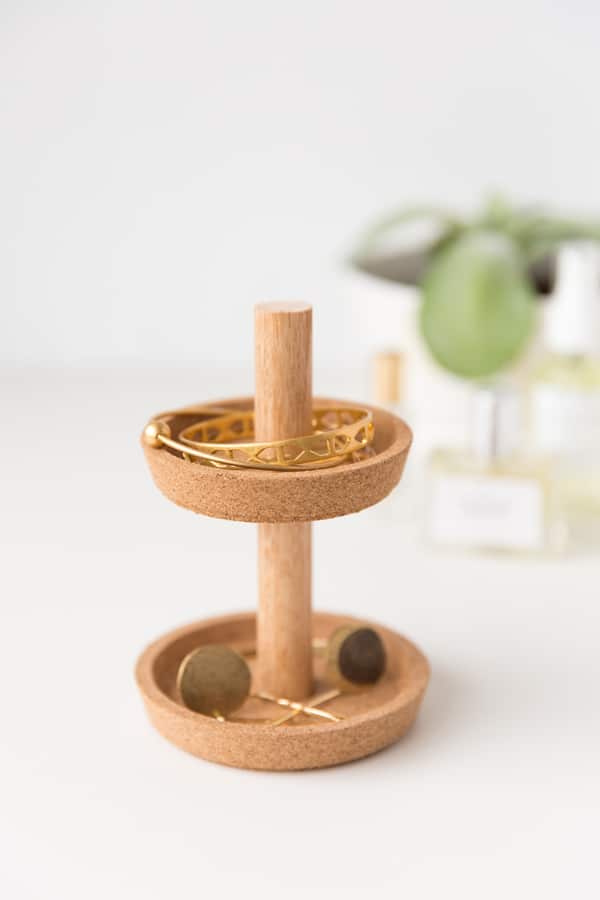 A DIY cork jewlery stand made from 2 Ikea coasters and a dowel